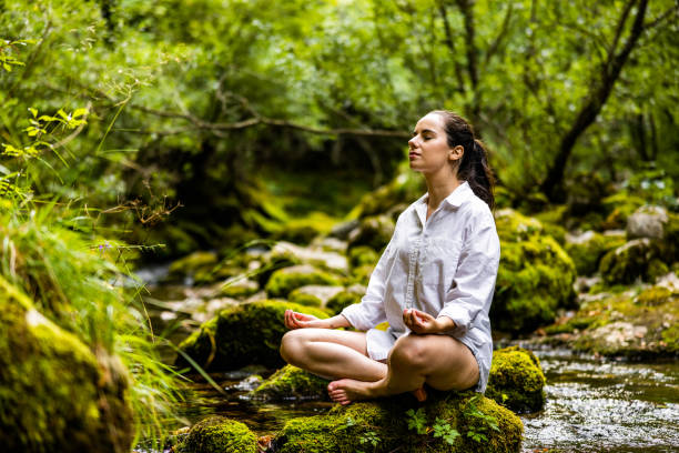 a woman meditating to enhance the power of mindfullness